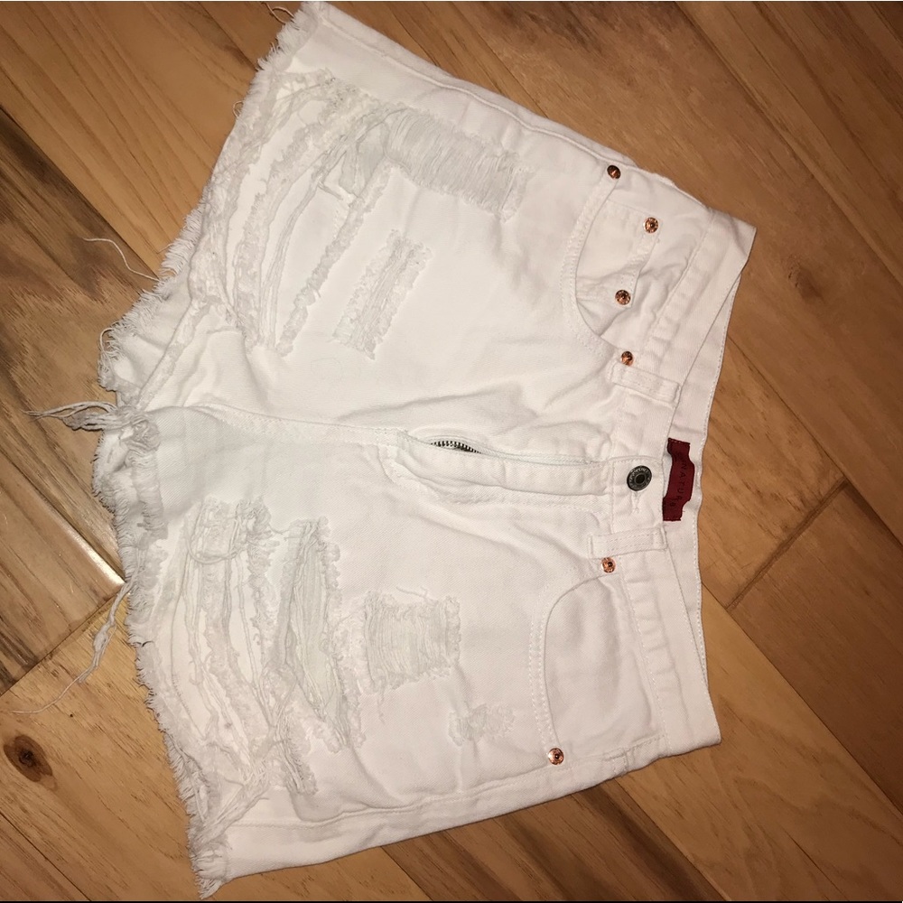 High waisted white distressed shorts